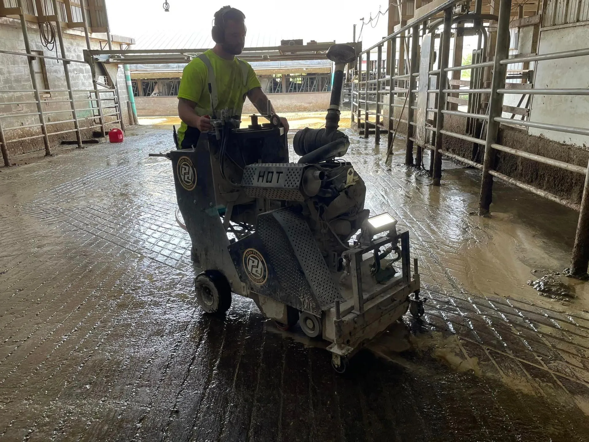 Grooving machine at work in barn